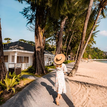 Thavorn Beach Village Resort & Spa Phuket Kamala Beach Esterno foto A woman walking on the beach